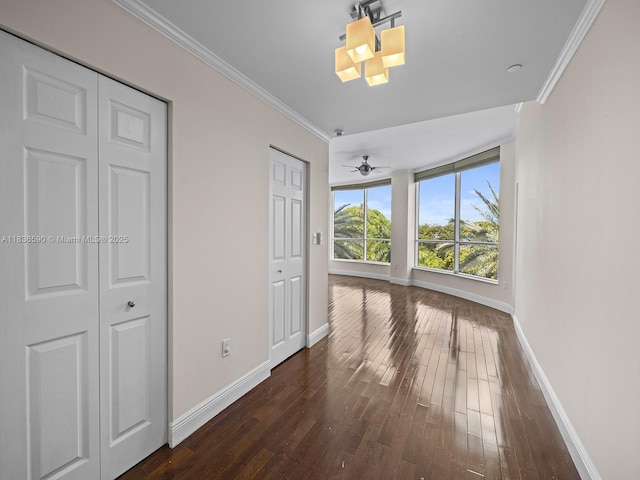 2645 S Bayshore Dr Unit 304, Miami, FL 33133 - interior space with dark wood-type flooring and crown molding
