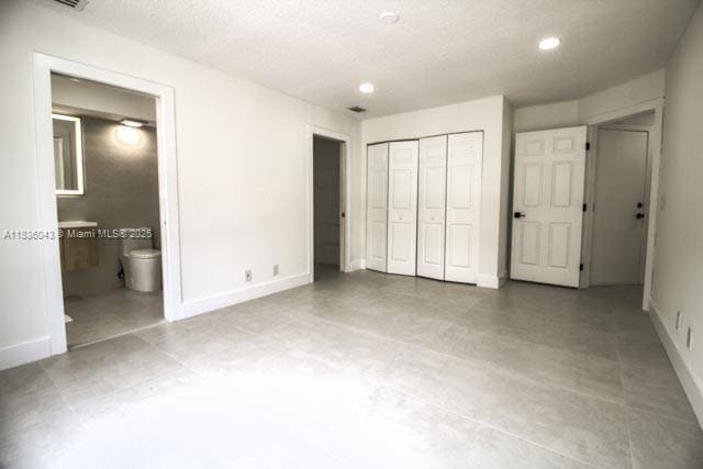 10204 Caracas St, Cooper City, FL 33026 - unfurnished bedroom with a closet, ensuite bathroom, and recessed lighting