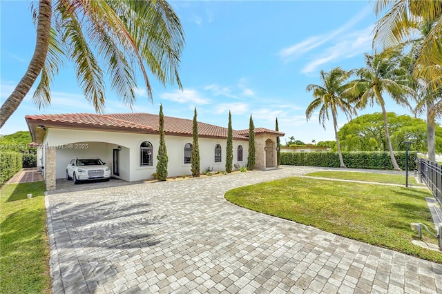 7970 SW 26th St, Miami, FL 33155 - mediterranean / spanish home with decorative driveway, stucco siding, a tile roof, and an attached carport