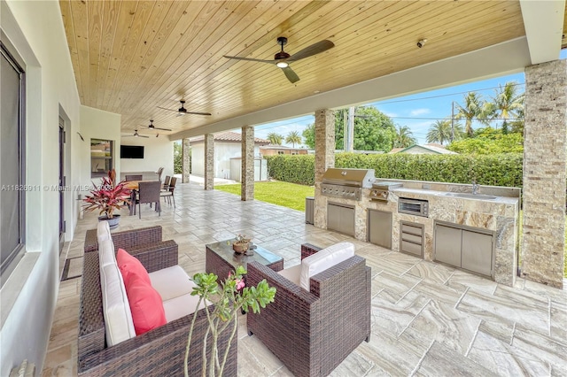 7970 SW 26th St, Miami, FL 33155 - view of patio with outdoor dining area, an outdoor kitchen, an outdoor living space, a ceiling fan, and a shed