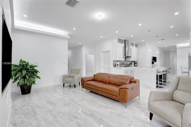 7970 SW 26th St, Miami, FL 33155 - living room featuring recessed lighting and light marble finish flooring