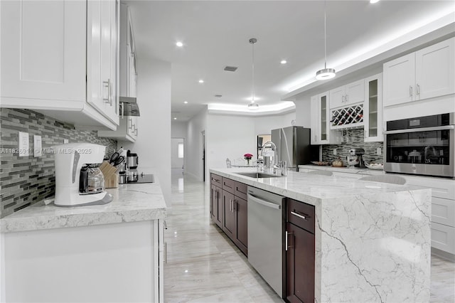 7970 SW 26th St, Miami, FL 33155 - kitchen featuring stainless steel appliances, tasteful backsplash, recessed lighting, white cabinets, and glass insert cabinets