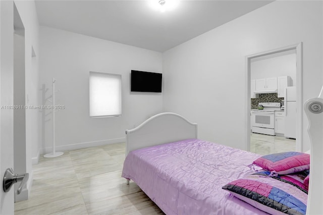 7970 SW 26th St, Miami, FL 33155 - bedroom featuring freestanding refrigerator and baseboards