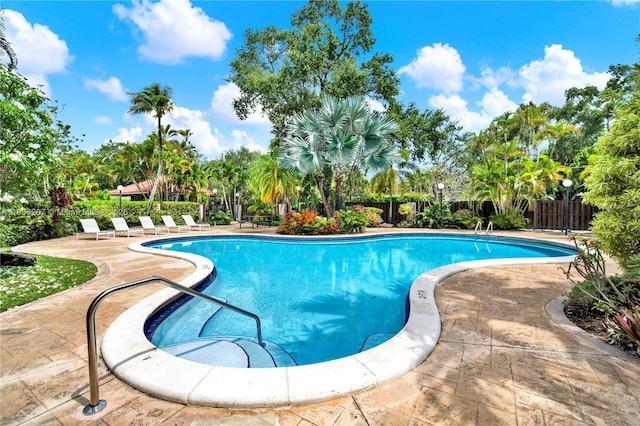 6886 N Kendall Dr Unit D102, Pinecrest, FL 33156 - view of pool featuring a patio and view of wooded area