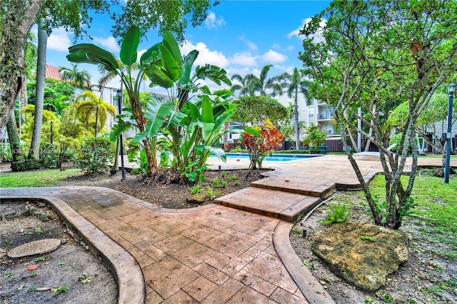 6886 N Kendall Dr Unit D102, Pinecrest, FL 33156 - surrounding community with a swimming pool and a patio
