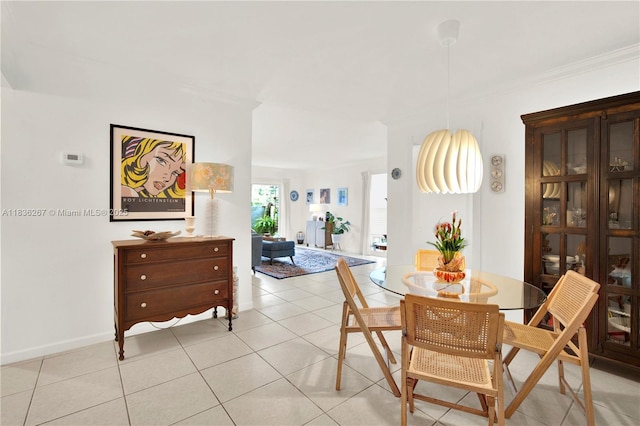 6886 N Kendall Dr Unit D102, Pinecrest, FL 33156 - dining space with crown molding and light tile patterned flooring