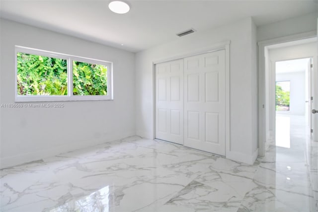 4808 Mango Dr, Tamarac, FL 33319 - unfurnished bedroom with a closet and marble finish floors