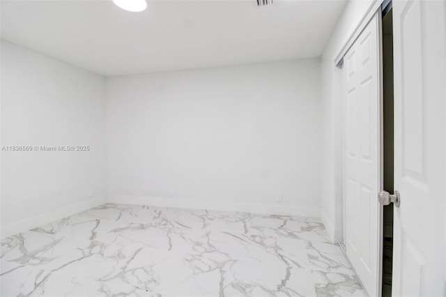 4808 Mango Dr, Tamarac, FL 33319 - unfurnished bedroom with marble finish floors and a closet