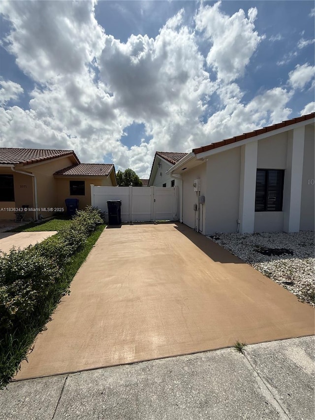 1061 NW 128th Ave, Miami, FL 33182 - view of property exterior featuring stucco siding and a tiled roof