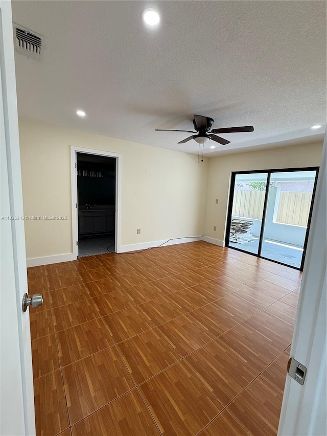 1061 NW 128th Ave, Miami, FL 33182 - spare room with ceiling fan, a textured ceiling, and recessed lighting