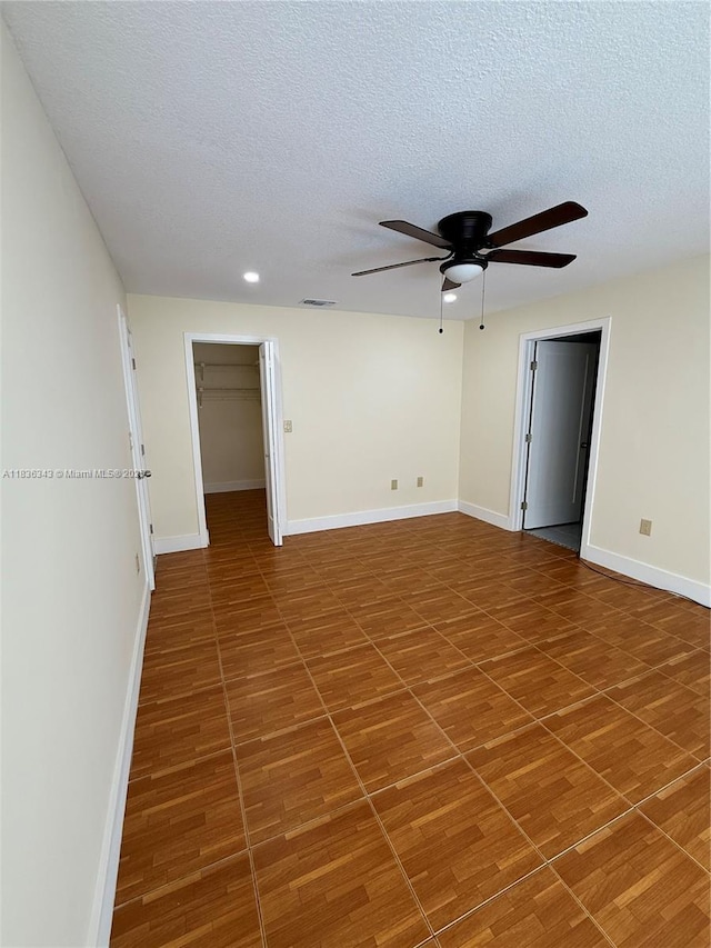 1061 NW 128th Ave, Miami, FL 33182 - spare room with a textured ceiling, ceiling fan, wood finished floors, and recessed lighting
