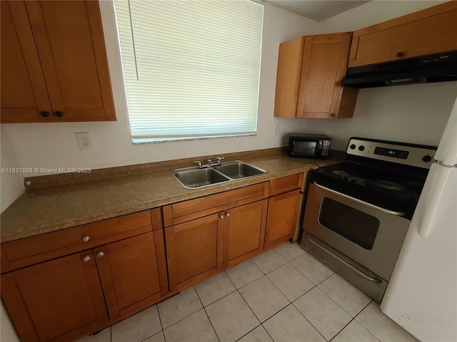 1750 NW 55th Ave Unit 103, Lauderhill, FL 33313 - kitchen featuring under cabinet range hood, stainless steel electric stove, black microwave, brown cabinets, and light tile patterned flooring
