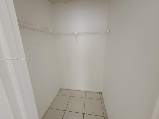 1750 NW 55th Ave Unit 103, Lauderhill, FL 33313 - spacious closet featuring tile patterned flooring