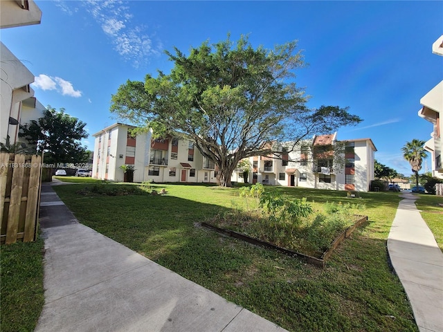 1750 NW 55th Ave Unit 103, Lauderhill, FL 33313 - view of home's community with a lawn and a residential view