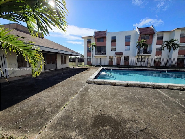 1750 NW 55th Ave Unit 103, Lauderhill, FL 33313 - community pool featuring a patio area