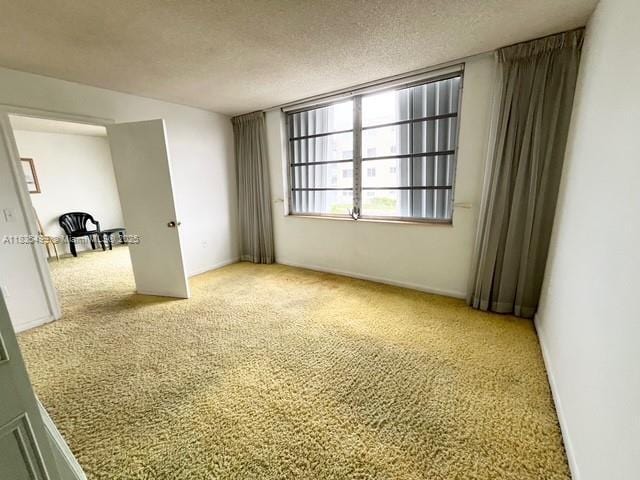 301 Croton Ave Unit 203, Lantana, FL 33462 - carpeted empty room featuring a textured ceiling