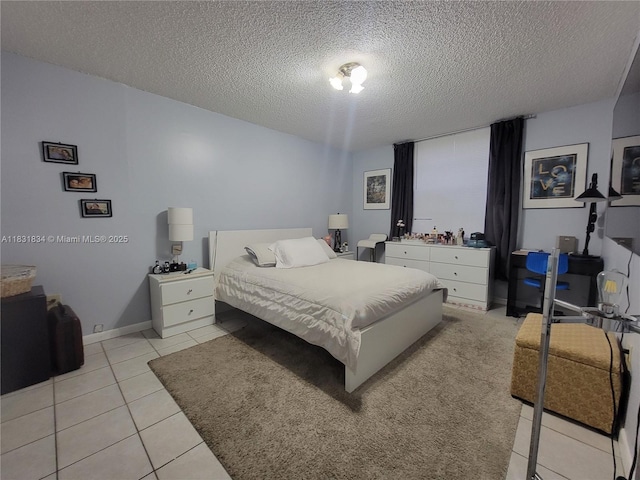 1796 NW 55th Ave Unit 103, Lauderhill, FL 33313 - bedroom with a textured ceiling and light tile patterned flooring