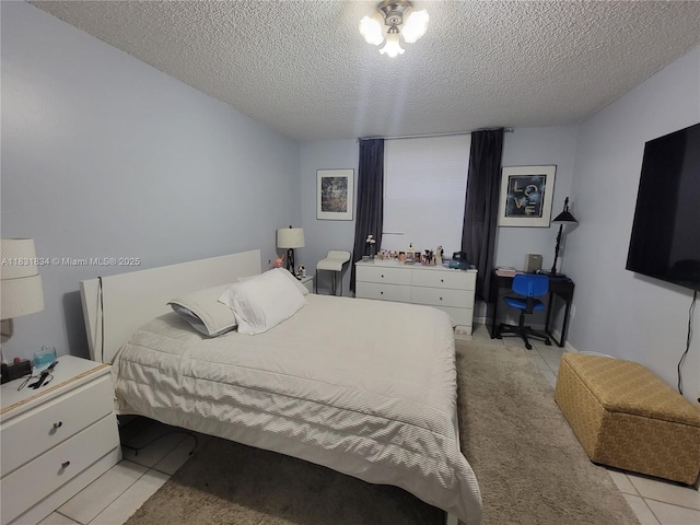 1796 NW 55th Ave Unit 103, Lauderhill, FL 33313 - bedroom with a textured ceiling and light tile patterned floors