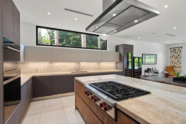 8875 SW 61st Ct, Pinecrest, FL 33156 - kitchen featuring modern cabinets, stainless steel gas stovetop, tasteful backsplash, ventilation hood, and recessed lighting