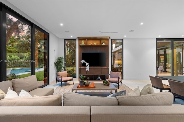 8875 SW 61st Ct, Pinecrest, FL 33156 - tiled living room with a wall of windows and recessed lighting
