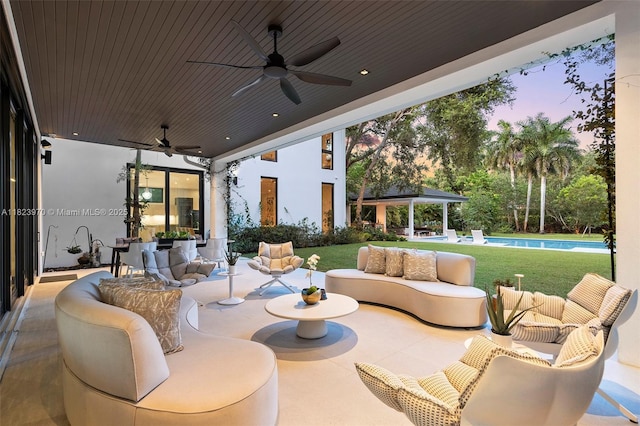 8875 SW 61st Ct, Pinecrest, FL 33156 - patio terrace at dusk featuring ceiling fan, outdoor lounge area, a patio area, an outdoor pool, and a gazebo