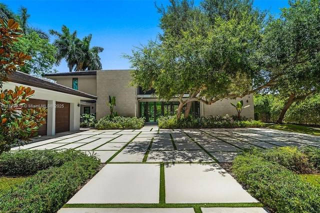 8875 SW 61st Ct, Pinecrest, FL 33156 - view of front of house featuring stucco siding and an attached garage