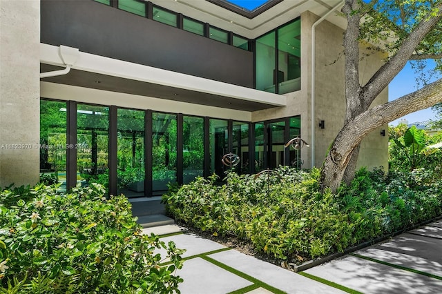 8875 SW 61st Ct, Pinecrest, FL 33156 - property entrance with stucco siding and french doors