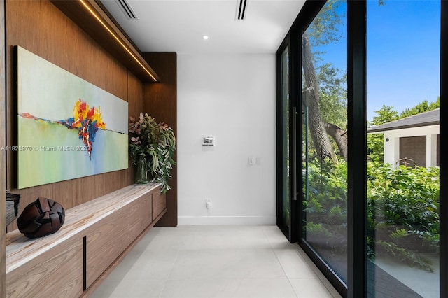 8875 SW 61st Ct, Pinecrest, FL 33156 - hall featuring a wall of windows and light tile patterned flooring