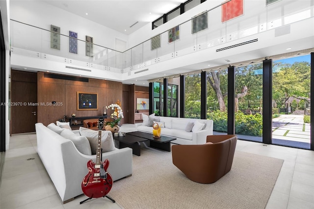 8875 SW 61st Ct, Pinecrest, FL 33156 - building lobby with a towering ceiling, wood walls, and expansive windows