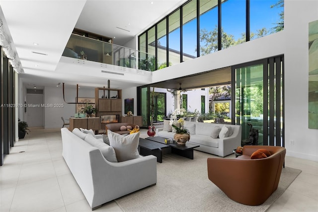 8875 SW 61st Ct, Pinecrest, FL 33156 - tiled living area featuring a towering ceiling and plenty of natural light