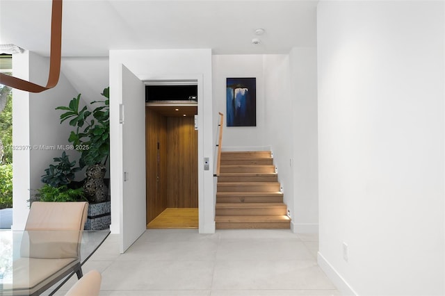 8875 SW 61st Ct, Pinecrest, FL 33156 - stairway featuring elevator and tile patterned floors