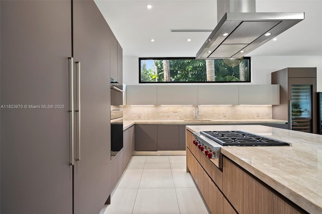 8875 SW 61st Ct, Pinecrest, FL 33156 - kitchen with high quality fridge, modern cabinets, island exhaust hood, tasteful backsplash, and recessed lighting