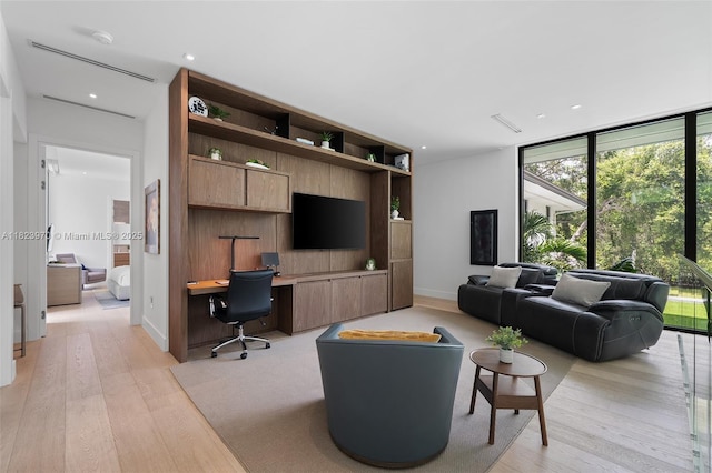 8875 SW 61st Ct, Pinecrest, FL 33156 - living area with light wood-style floors, built in study area, recessed lighting, and floor to ceiling windows