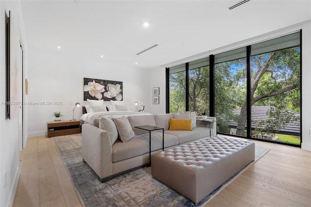 8875 SW 61st Ct, Pinecrest, FL 33156 - bedroom with recessed lighting, wood finished floors, floor to ceiling windows, and access to exterior