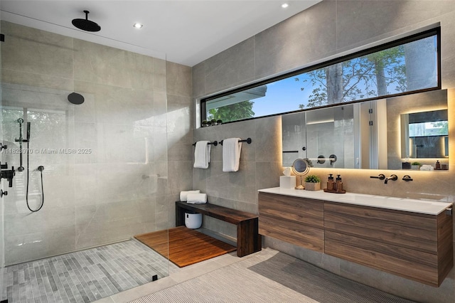 8875 SW 61st Ct, Pinecrest, FL 33156 - bathroom featuring vanity, a walk in shower, tile patterned flooring, and tile walls