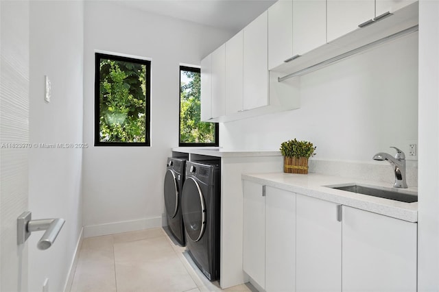 8875 SW 61st Ct, Pinecrest, FL 33156 - washroom featuring washer and dryer, cabinet space, and light tile patterned floors