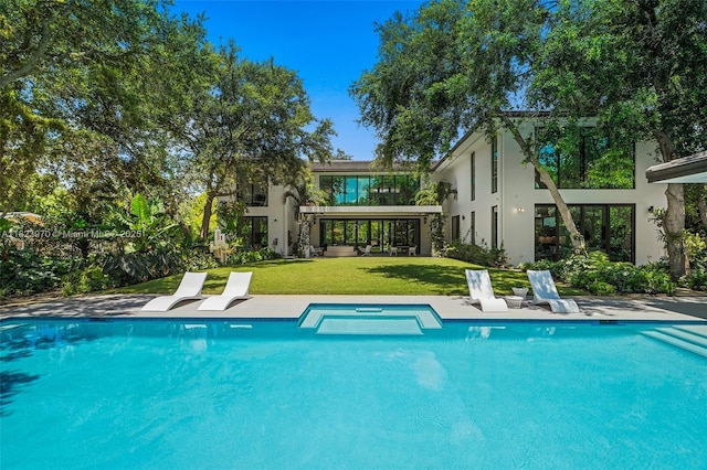 8875 SW 61st Ct, Pinecrest, FL 33156 - view of pool featuring a lawn, a pool with connected hot tub, and a patio area