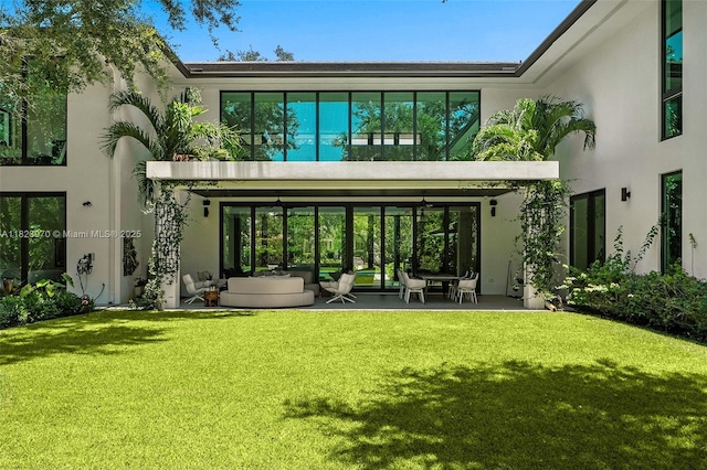 8875 SW 61st Ct, Pinecrest, FL 33156 - rear view of house with a yard and stucco siding