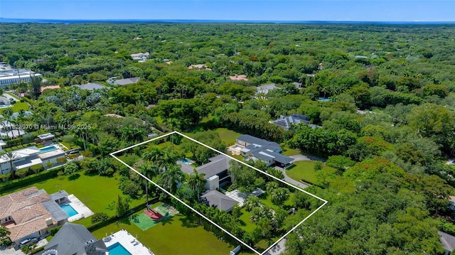 8875 SW 61st Ct, Pinecrest, FL 33156 - aerial view of property and surrounding area with a heavily wooded area and property parcel outlined