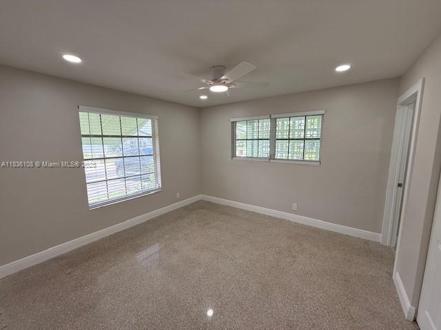 917 SE 15th Ct, Deerfield Beach, FL 33441 - carpeted spare room with ceiling fan, healthy amount of natural light, and recessed lighting