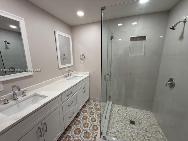 917 SE 15th Ct, Deerfield Beach, FL 33441 - bathroom with a stall shower, double vanity, recessed lighting, and tile patterned floors