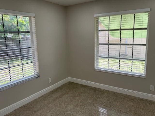 917 SE 15th Ct, Deerfield Beach, FL 33441 - carpeted empty room featuring plenty of natural light