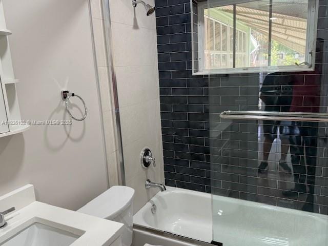 917 SE 15th Ct, Deerfield Beach, FL 33441 - bathroom with bath / shower combo with glass door and vanity