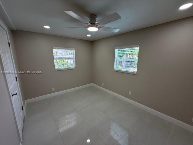 917 SE 15th Ct, Deerfield Beach, FL 33441 - spare room featuring a ceiling fan, healthy amount of natural light, recessed lighting, and light tile patterned floors