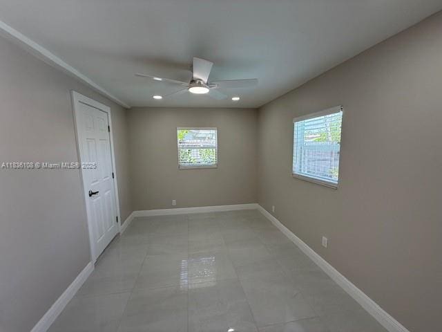 917 SE 15th Ct, Deerfield Beach, FL 33441 - spare room featuring healthy amount of natural light, a ceiling fan, and recessed lighting