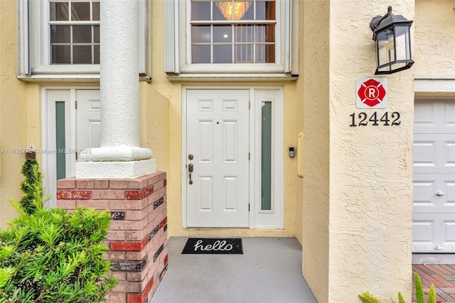 12442 NW 10th Ct Unit C-14, Coral Springs, FL 33071 - doorway to property featuring stucco siding