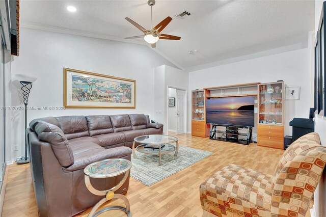 12442 NW 10th Ct Unit C-14, Coral Springs, FL 33071 - living area with lofted ceiling, plenty of natural light, ceiling fan, light wood-style floors, and ornamental molding