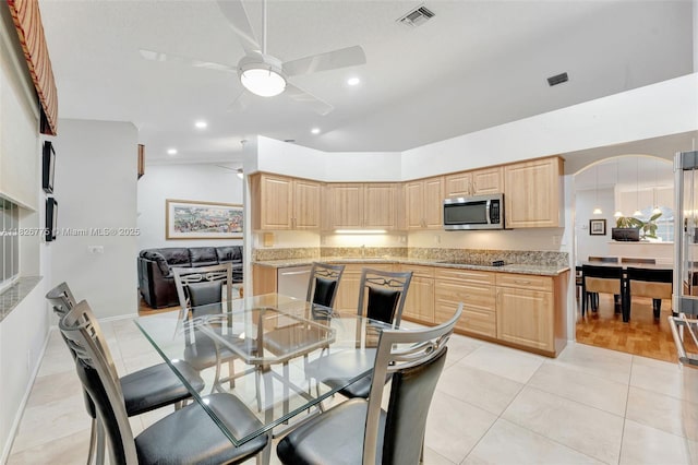 12442 NW 10th Ct Unit C-14, Coral Springs, FL 33071 - dining area with ceiling fan, arched walkways, recessed lighting, and light tile patterned flooring