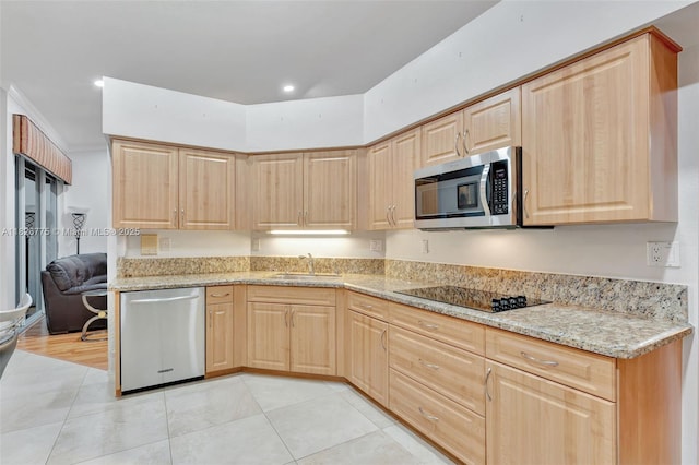 12442 NW 10th Ct Unit C-14, Coral Springs, FL 33071 - kitchen featuring stainless steel appliances, light brown cabinets, light stone countertops, and light tile patterned flooring