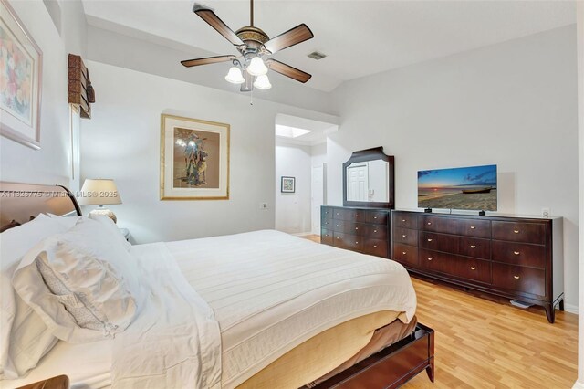 12442 NW 10th Ct Unit C-14, Coral Springs, FL 33071 - bedroom with lofted ceiling, multiple windows, light wood-style flooring, and a ceiling fan